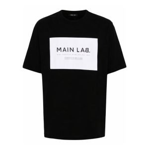 Balmain slogan-patch cotton T-shirt front view showing logo patch and cotton fabric detail