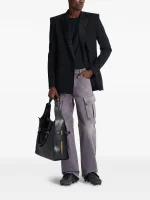 Back view of Balmain cargo jeans with rear pocket detail and premium denim finish