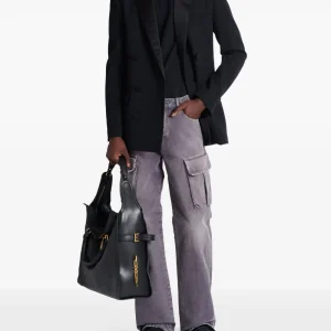 Back view of Balmain cargo jeans with rear pocket detail and premium denim finish