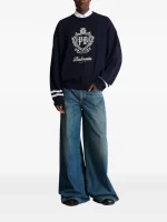 Back view of Balmain faded wide-leg jeans with wide-leg denim fit and faded blue wash detail