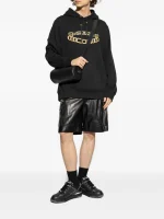 Back view of Balmain logo-print hoodie with premium cotton fabric and relaxed streetwear fit