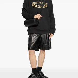 Back view of Balmain logo-print hoodie with premium cotton fabric and relaxed streetwear fit