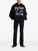 Back view of Balmain long-sleeved cotton hoodie showing full sleeve design and fit