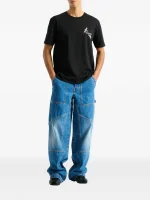 Back view of Balmain blue denim carpenter jeans showing rear pockets and carpenter denim design