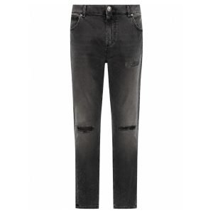 Front view of Balmain distressed finish slim-cut jeans showing the slim-cut fit, distressed denim details, waistband design, front pockets, and overall silhouette.